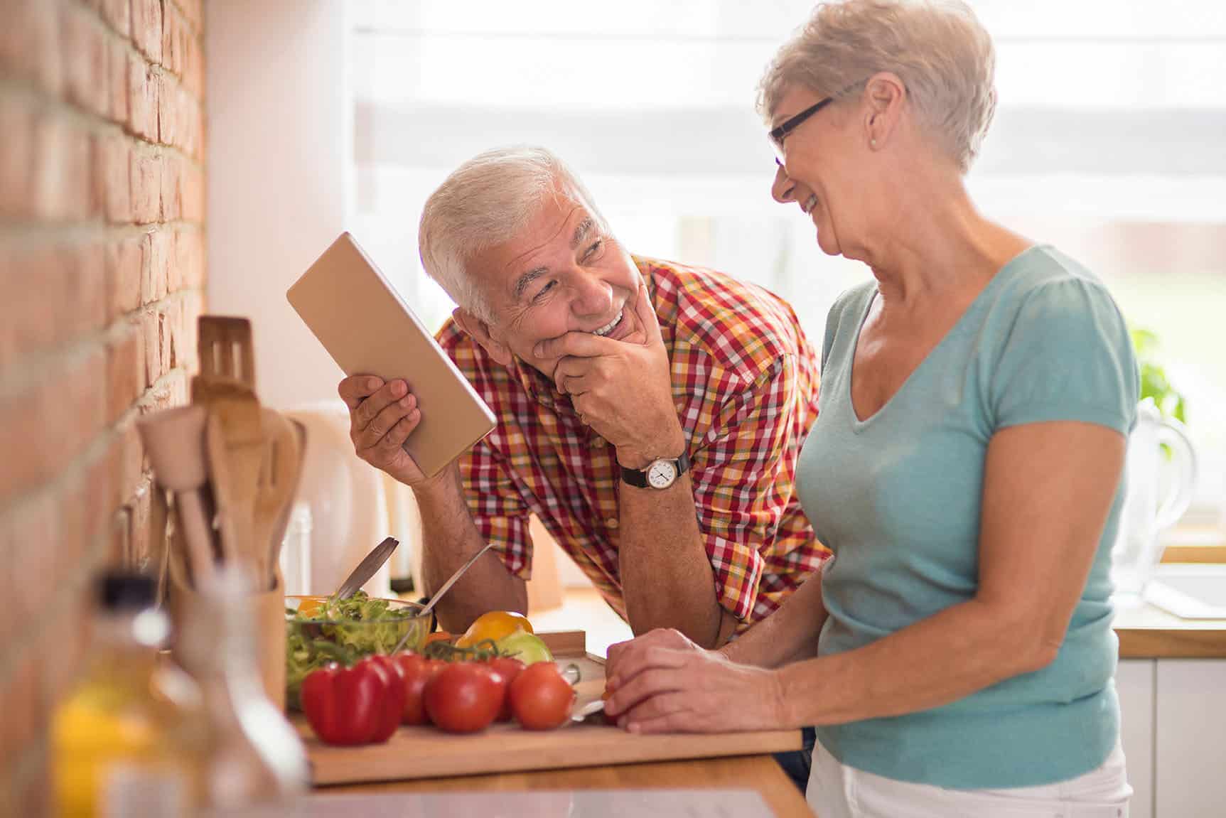 Modern senior couple spending time in the kitchen Retirement Income Investment Strategy